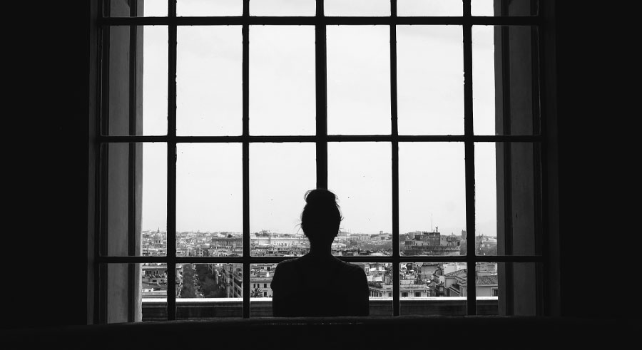 girl looking at window