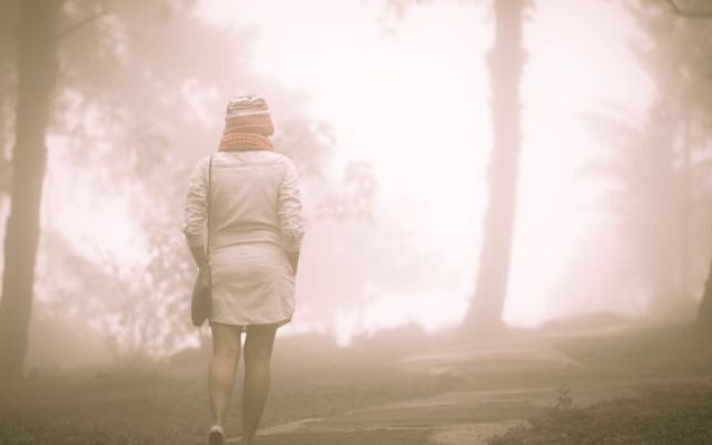 Lone girl in the woods