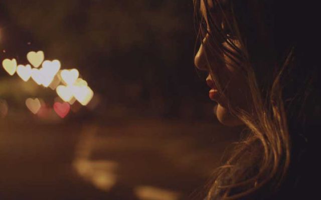 woman looking at the night lights