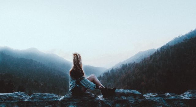 Woman over a rock